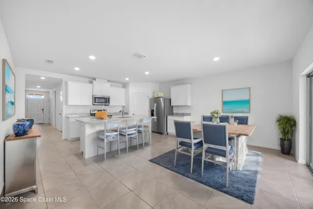 a view of an empty room and glass door