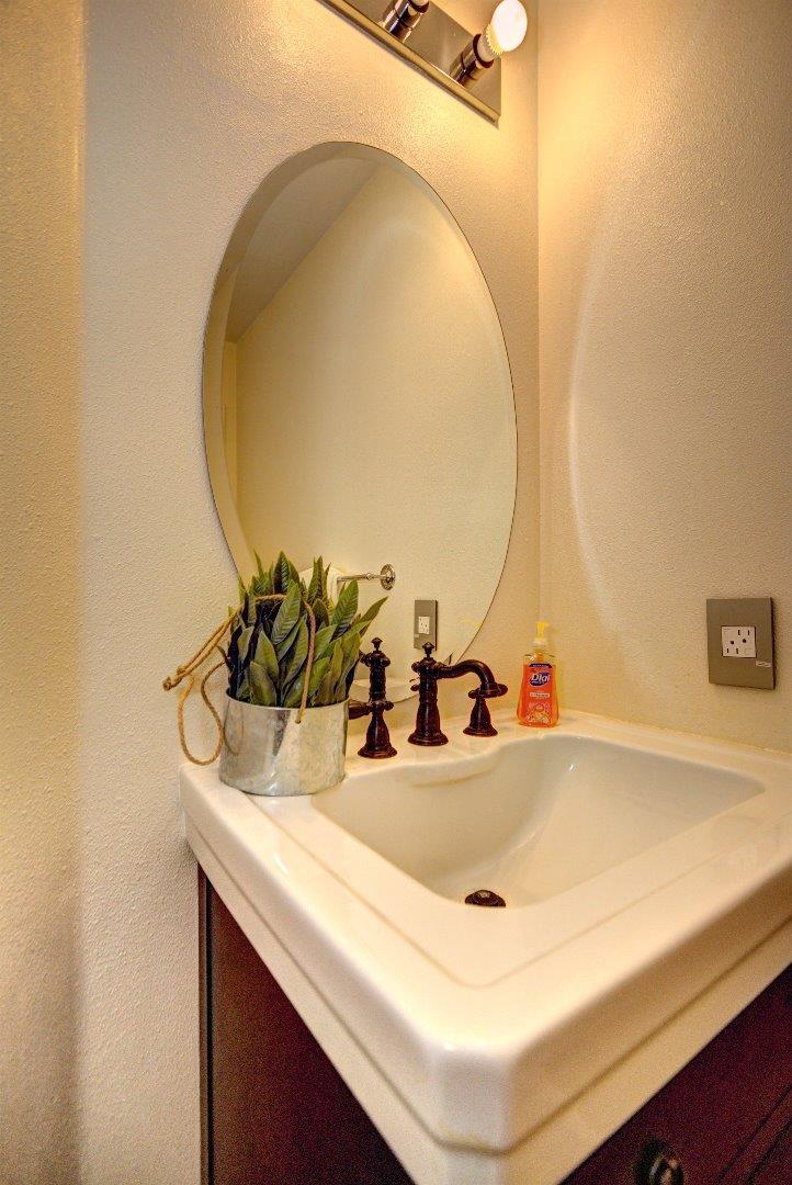 10197 Macadam Lane Cupertino, CA 95014 - Photo 11 of 28 a bathroom with a sink and a mirror