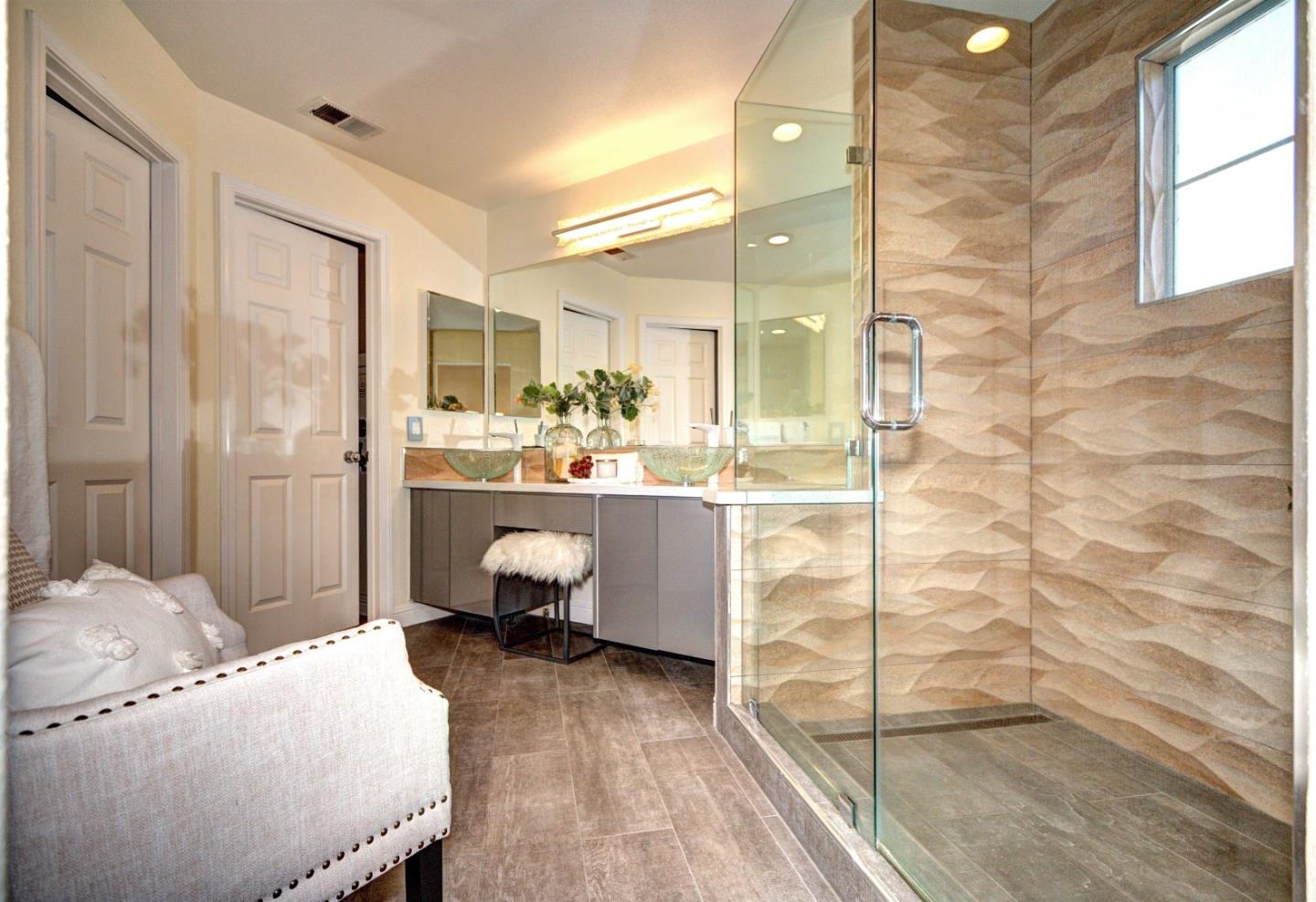 10197 Macadam Lane Cupertino, CA 95014 - Photo 13 of 28 a bedroom with a bed and glass door