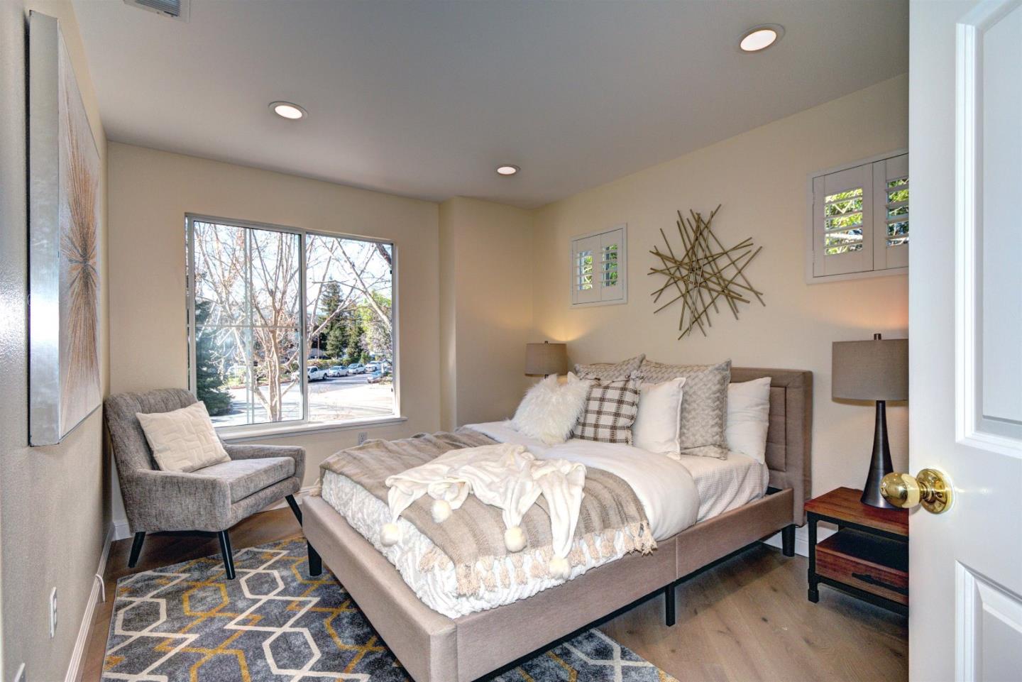 10197 Macadam Lane Cupertino, CA 95014 - Photo 15 of 28 a bedroom with a bed and a couch