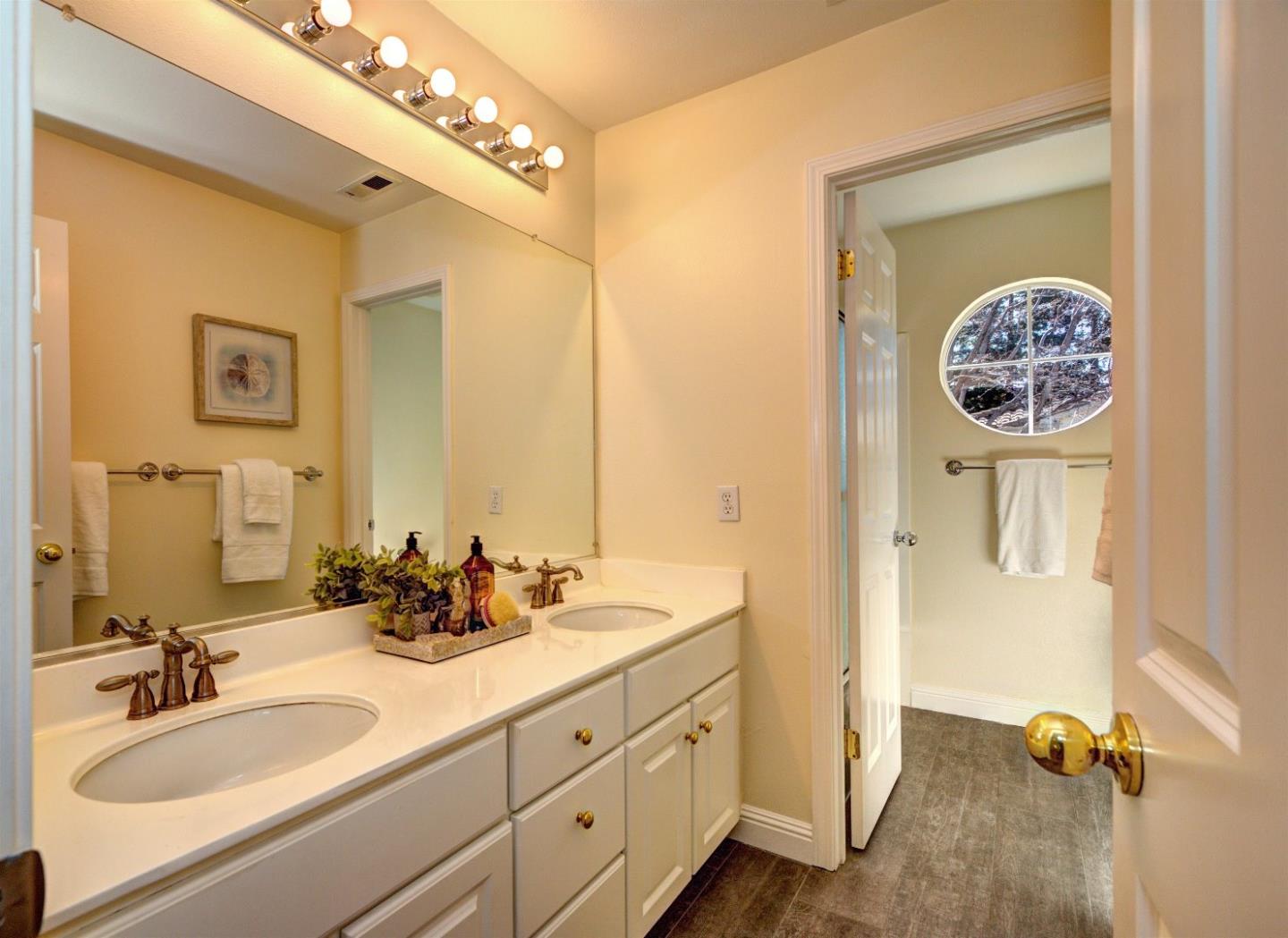 10197 Macadam Lane Cupertino, CA 95014 - Photo 16 of 28 a bathroom with a sink and a mirror