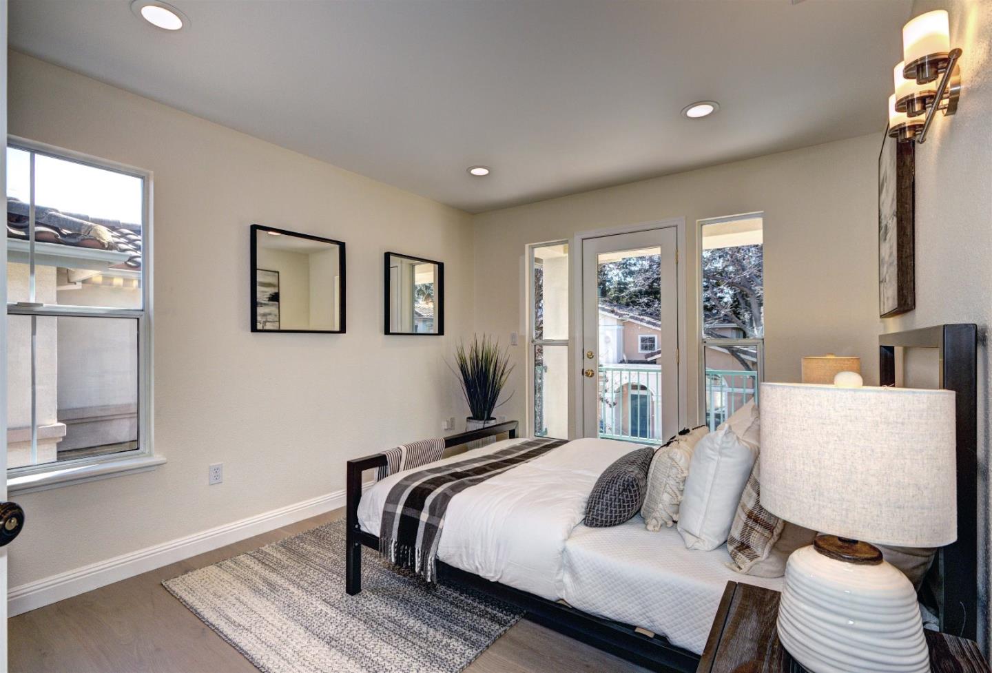 10197 Macadam Lane Cupertino, CA 95014 - Photo 18 of 28 a bedroom with a bed and wooden floor