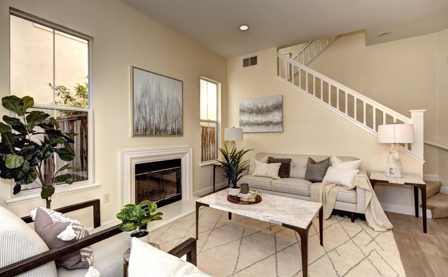 10197 Macadam Lane Cupertino, CA 95014 - Photo 4 of 28 a living room with furniture fireplace and potted plants