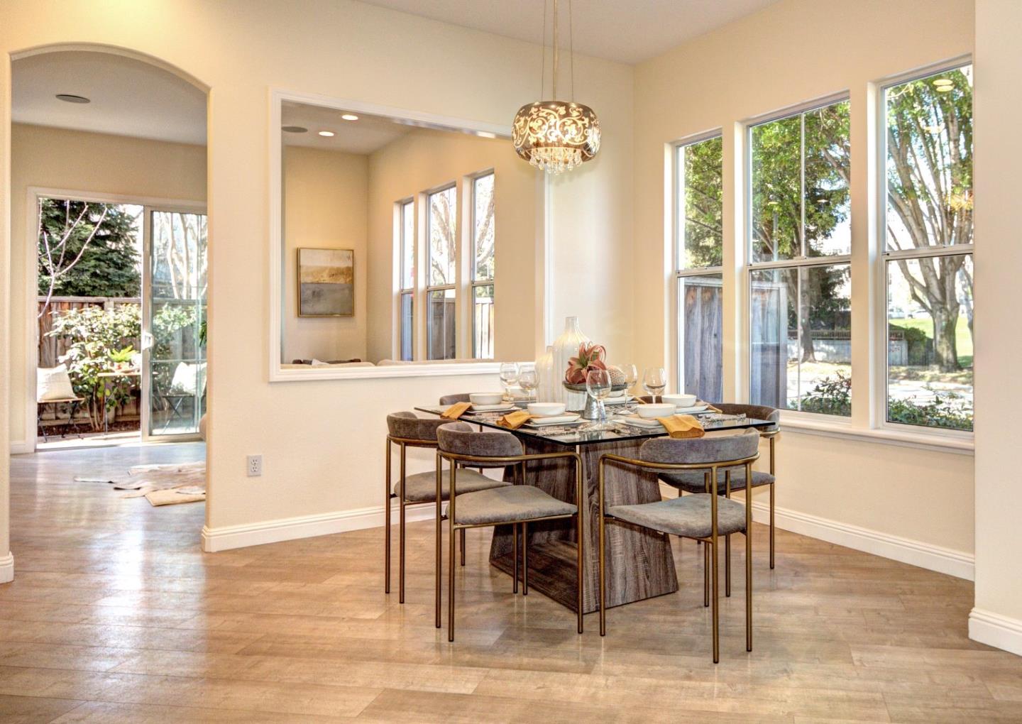 10197 Macadam Lane Cupertino, CA 95014 - Photo 6 of 28 a view of a a dining room with furniture window and wooden floor