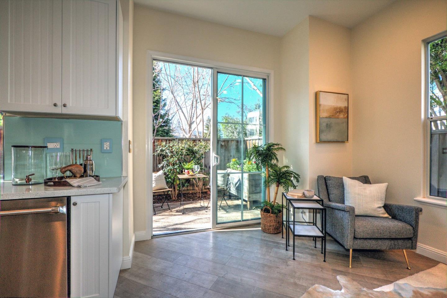 10197 Macadam Lane Cupertino, CA 95014 - Photo 9 of 28 a living room with furniture and a potted plant