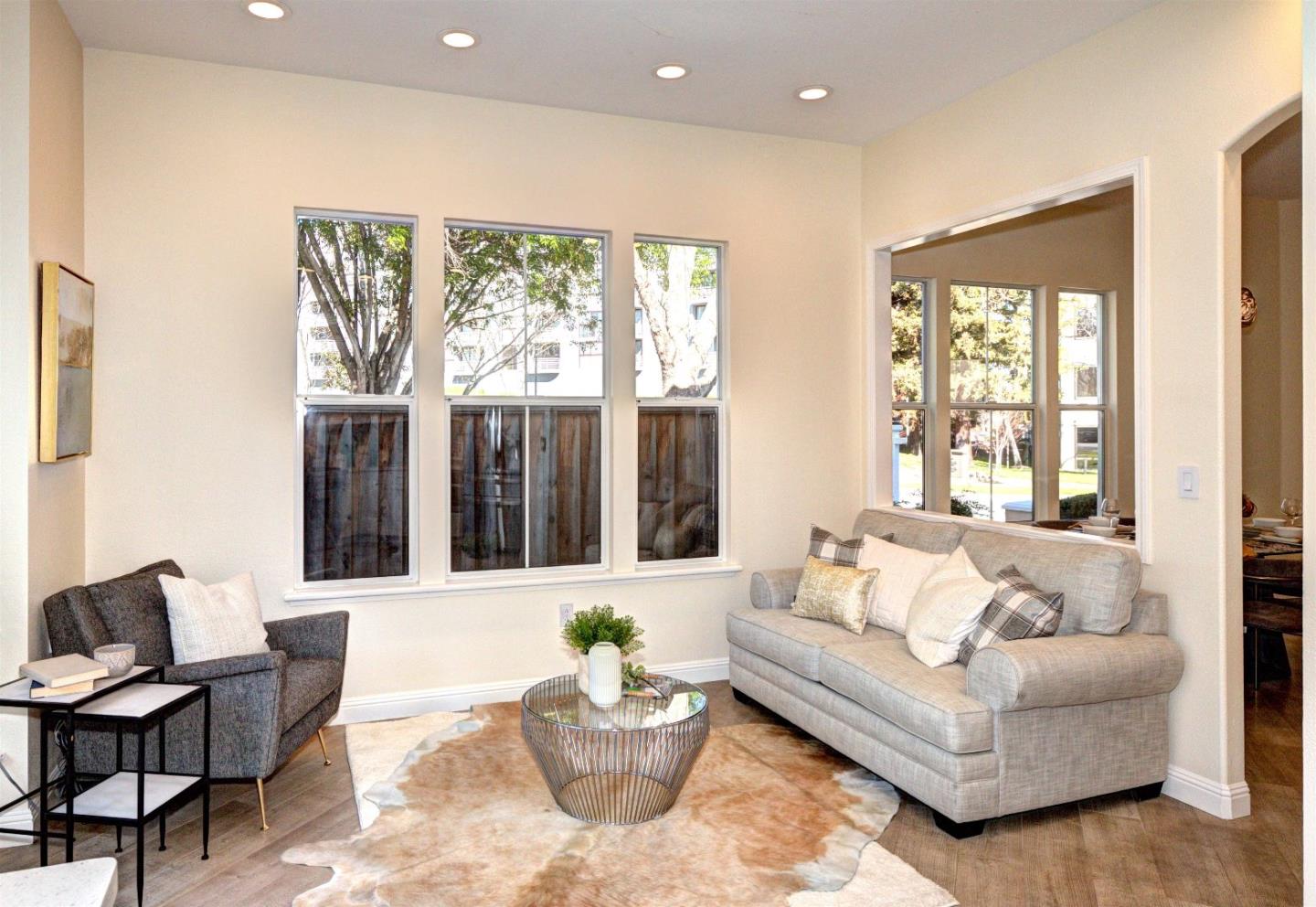 10197 Macadam Lane Cupertino, CA 95014 - Photo 10 of 28 a living room with furniture and a large window