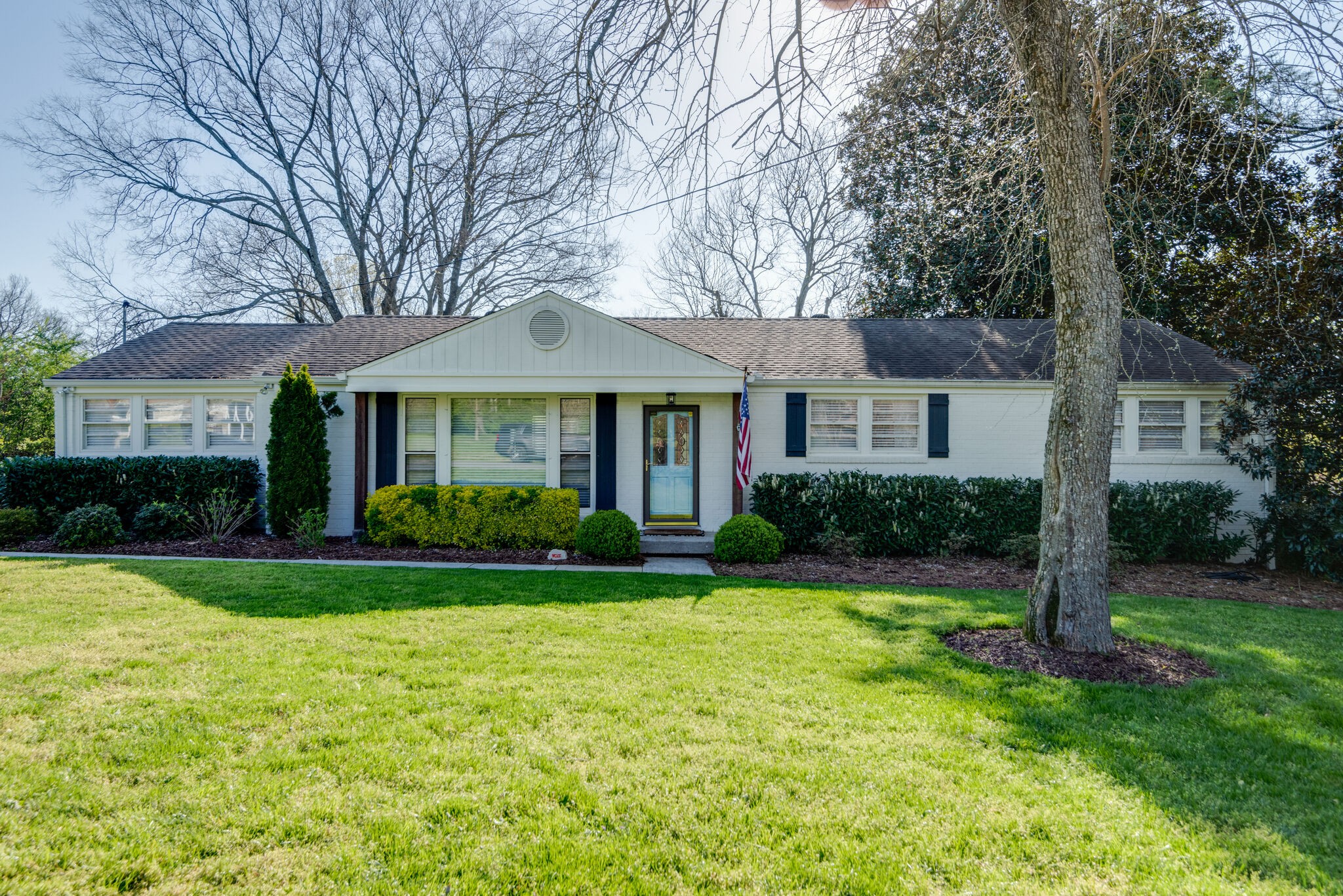 4902 Timberhill Drive Nashville, TN 37211 - Photo 1 of 30 a front view of a house with a yard and trees