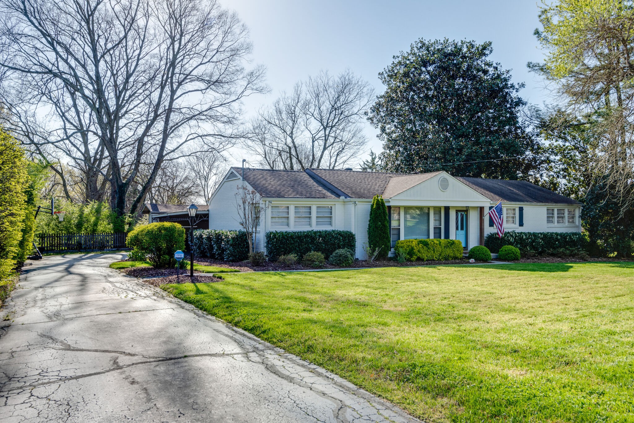 4902 Timberhill Drive Nashville, TN 37211 - Photo 2 of 30 a front view of a house with yard porch and green space