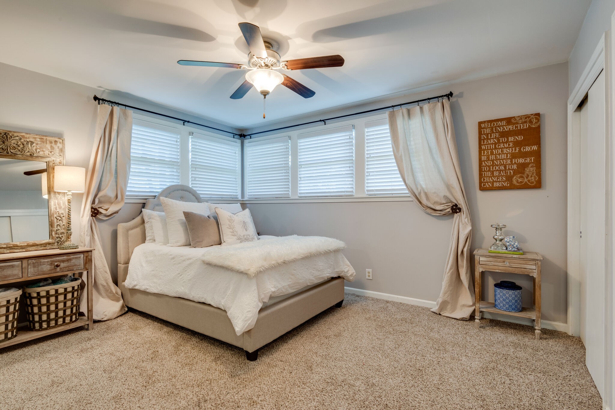 4902 Timberhill Drive Nashville, TN 37211 - Photo 15 of 30 a spacious bedroom with a bed a couch and a chandelier