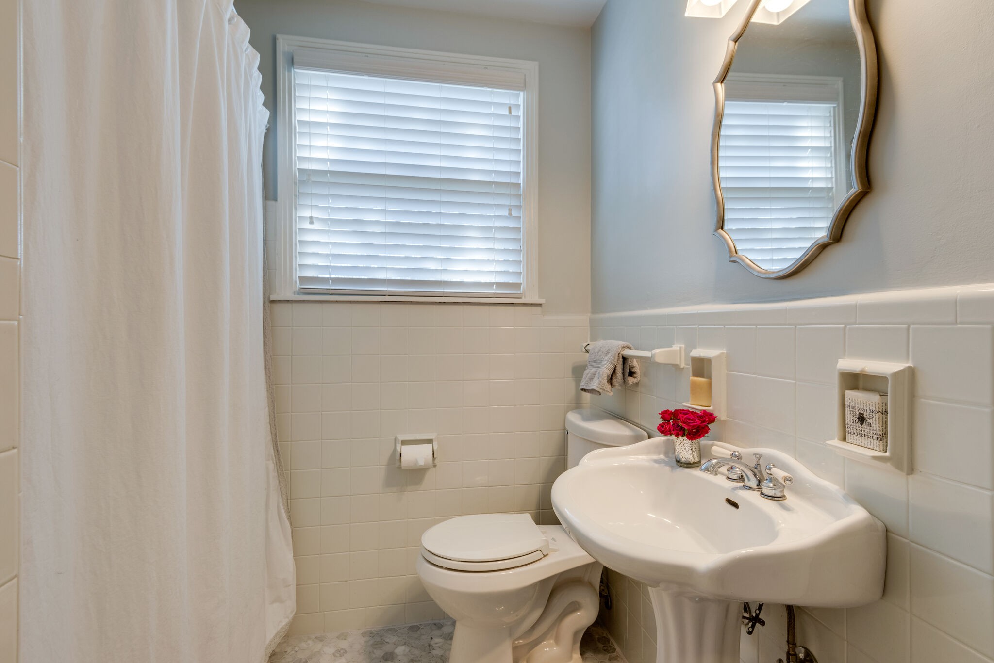 4902 Timberhill Drive Nashville, TN 37211 - Photo 17 of 30 a bathroom with a toilet sink and a window