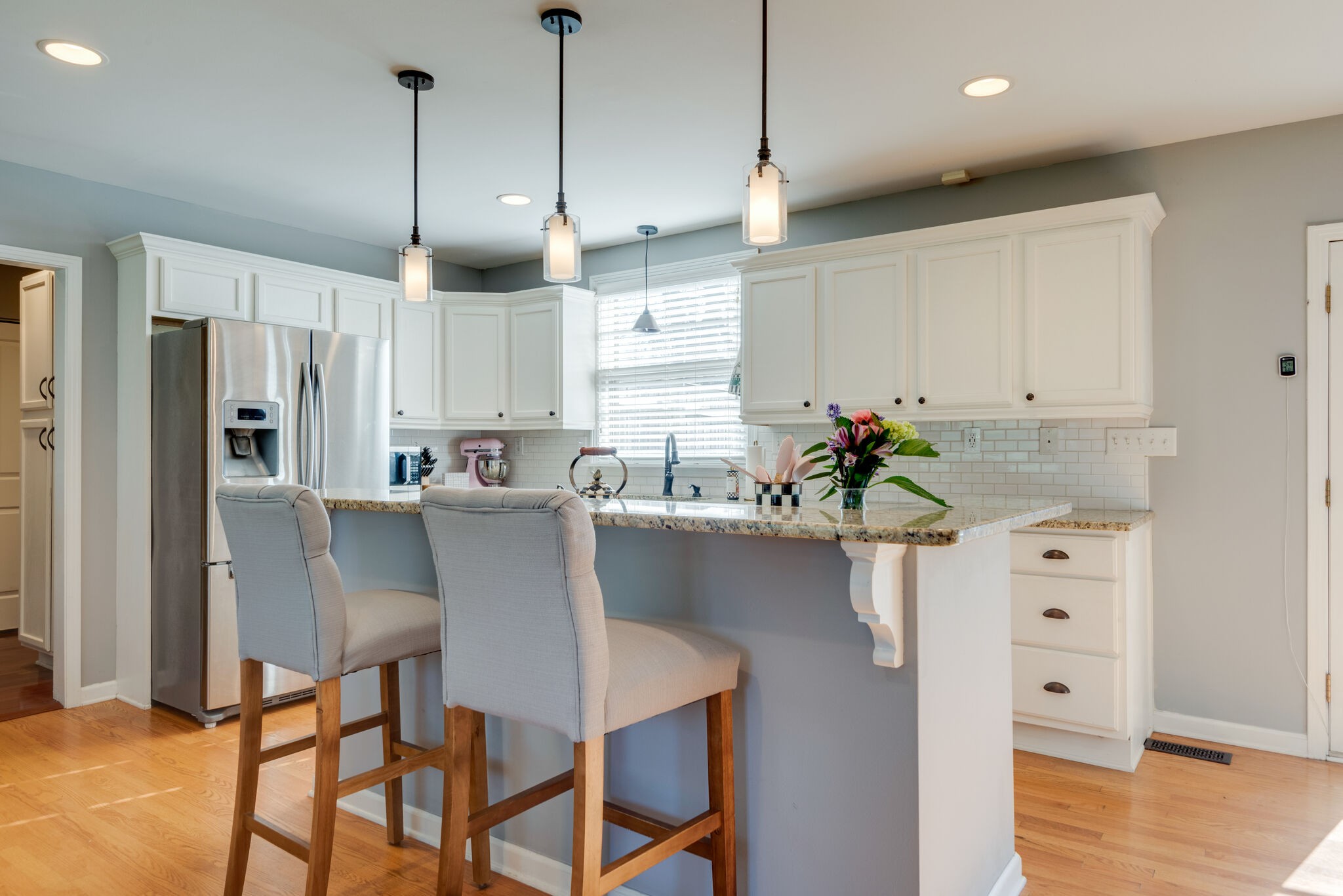 4902 Timberhill Drive Nashville, TN 37211 - Photo 10 of 30 a kitchen with white cabinets and stainless steel appliances