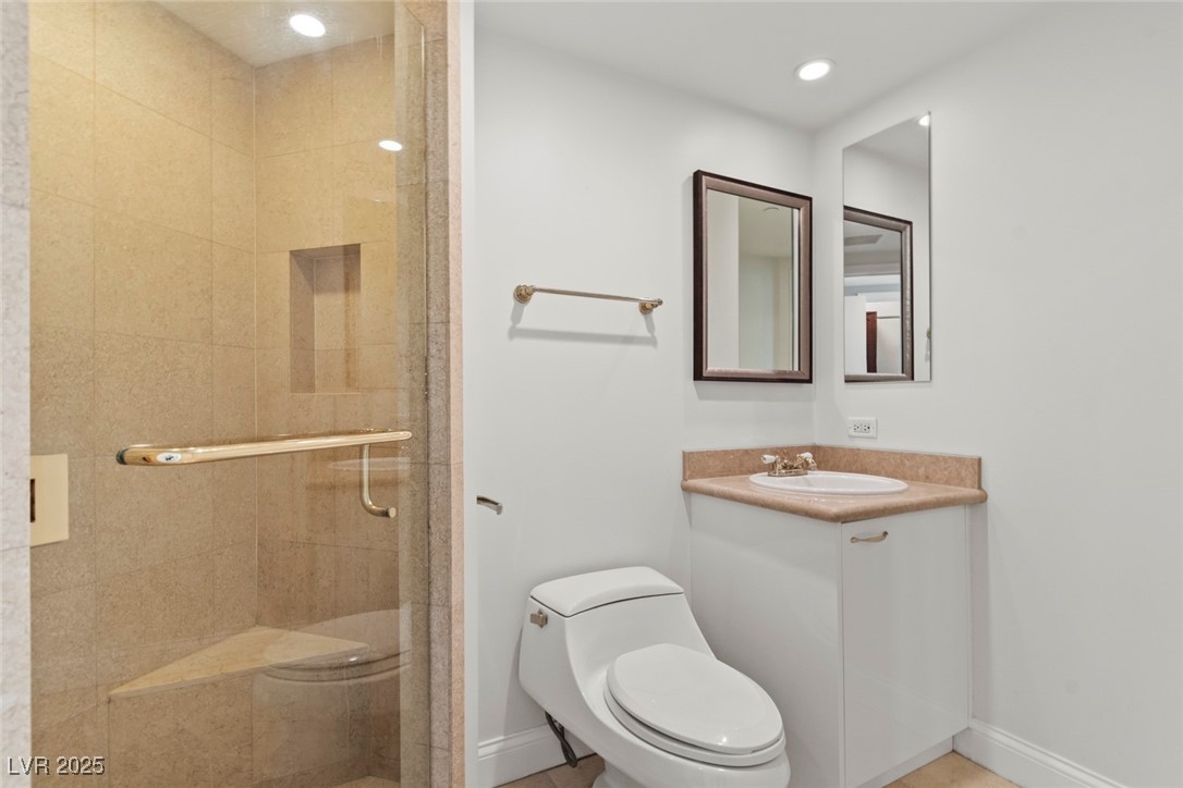 2747 Paradise Road, Unit 2206 Las Vegas, NV 89109 - Photo 13 of 15 Full bath featuring a stall shower, vanity, and recessed lighting