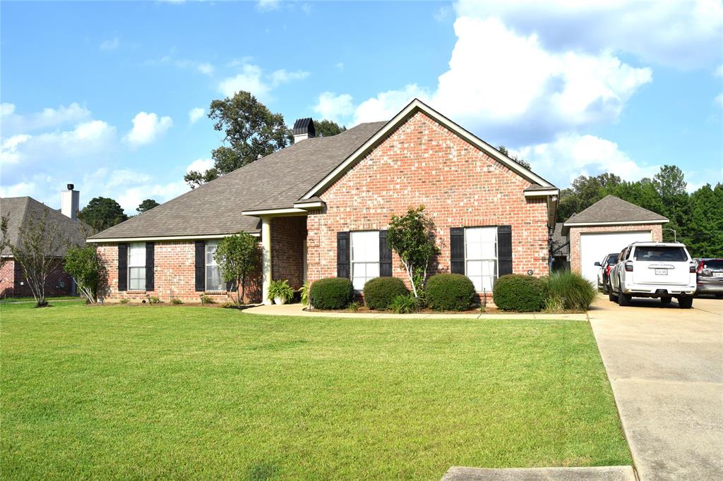 605 Jade Haughton, LA 71037 - Photo 1 of 34 Traditional brick exterior featuring black louvered shutters and a covered entry with 15x30 shop on slab