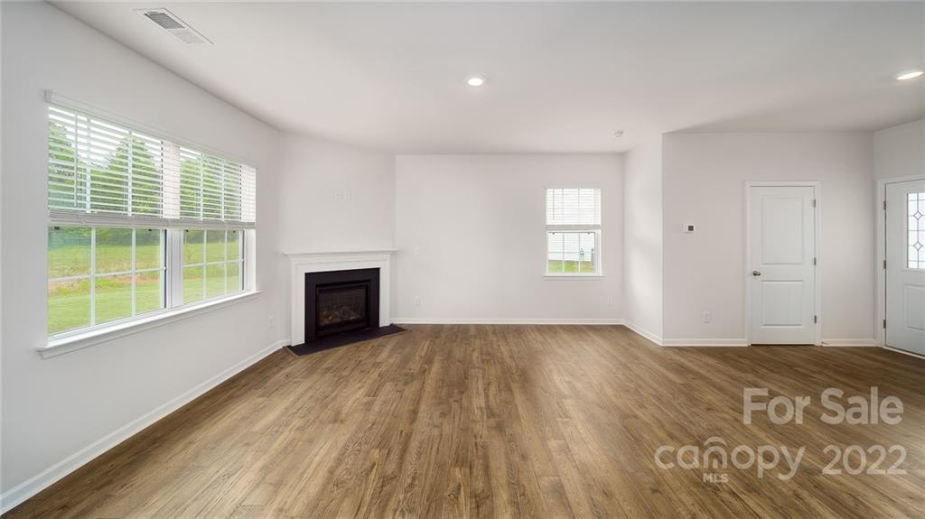 356 Gaines Road Clover, SC 29710 - Photo 41 of 48 a view of an empty room with wooden floor and a window