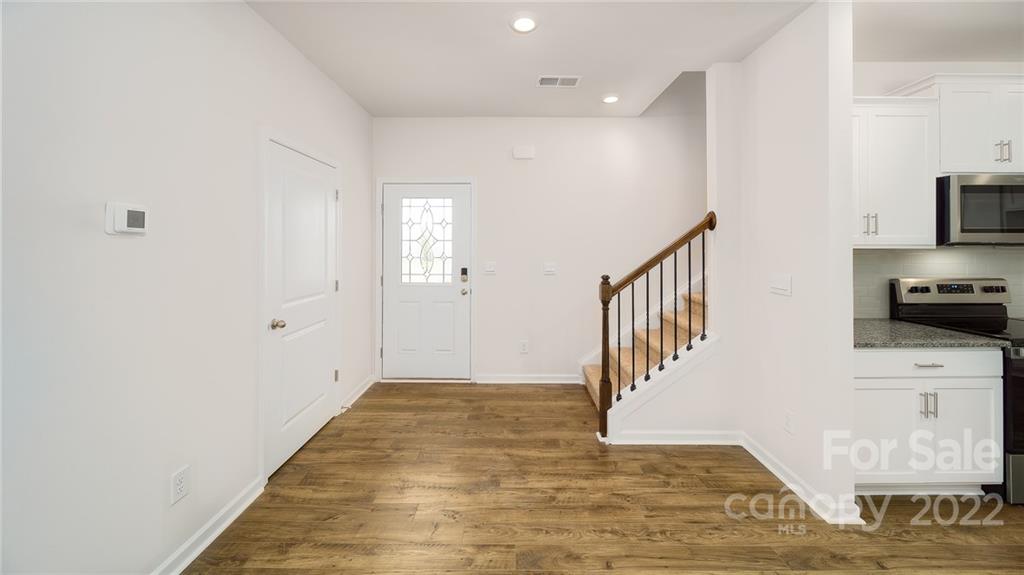 356 Gaines Road Clover, SC 29710 - Photo 43 of 48 a view of a hallway with wooden floor and staircase