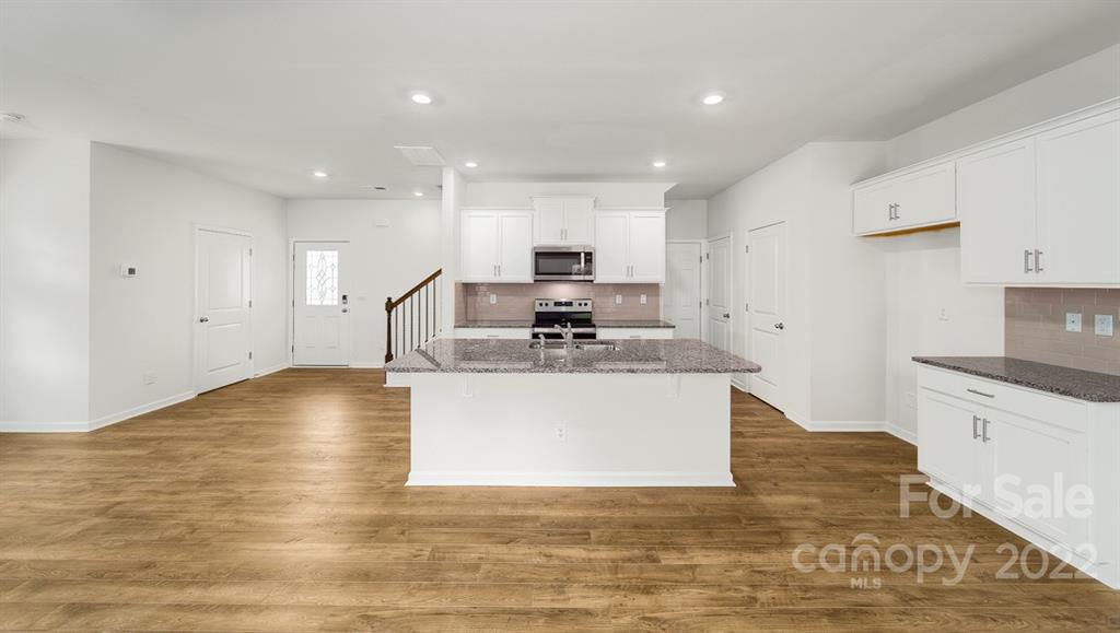 356 Gaines Road Clover, SC 29710 - Photo 7 of 48 a view of kitchen with granite countertop stove top oven and cabinets