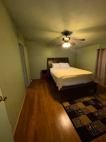 a bed room with a bed and a chandelier