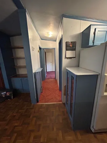 a hallway with washer and dryer