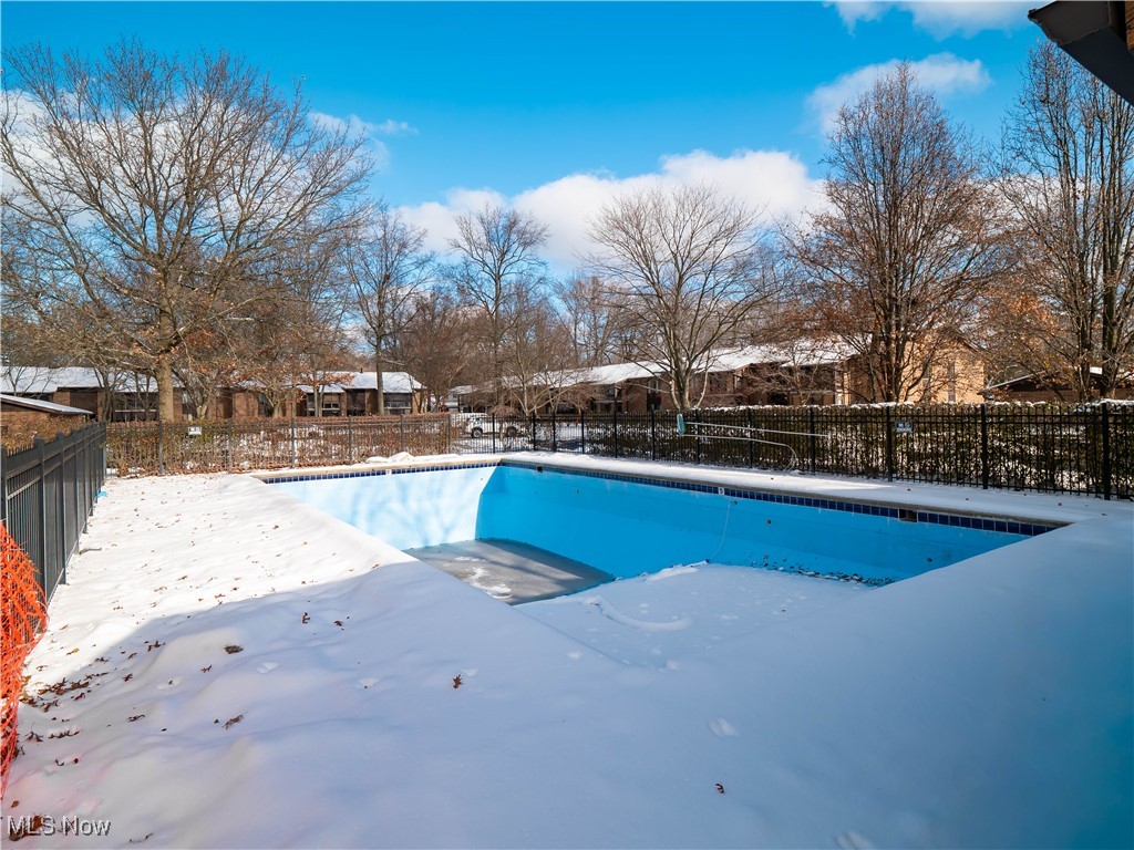 22968 Maple Ridge Road, Unit 103 North Olmsted, OH 44070 - Photo 19 of 25 Snow covered pool featuring a residential view