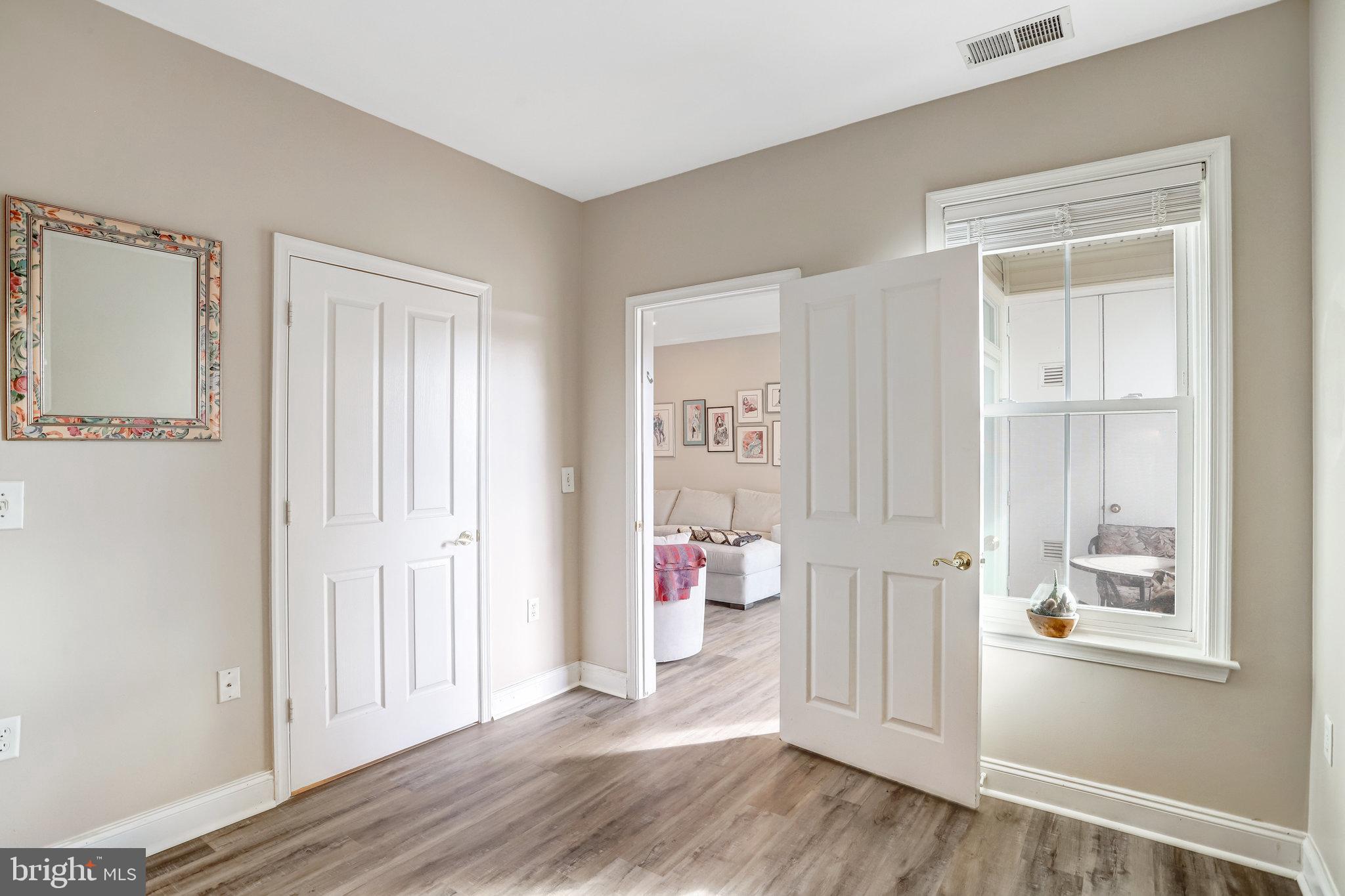 2500 Waterside Drive, Unit 303 Frederick, MD 21701 - Photo 18 of 47 a view of entryway with wooden floor