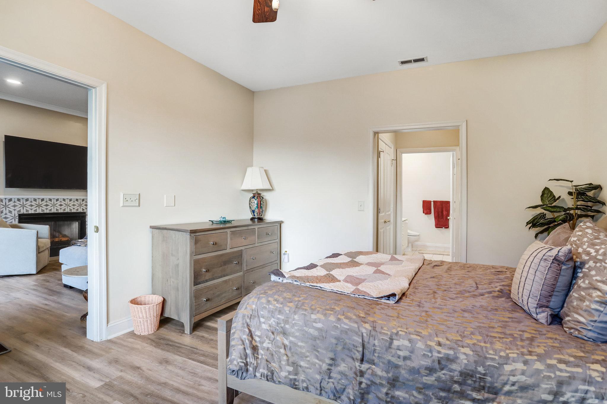 2500 Waterside Drive, Unit 303 Frederick, MD 21701 - Photo 22 of 47 a bedroom with a bed and a flat screen tv