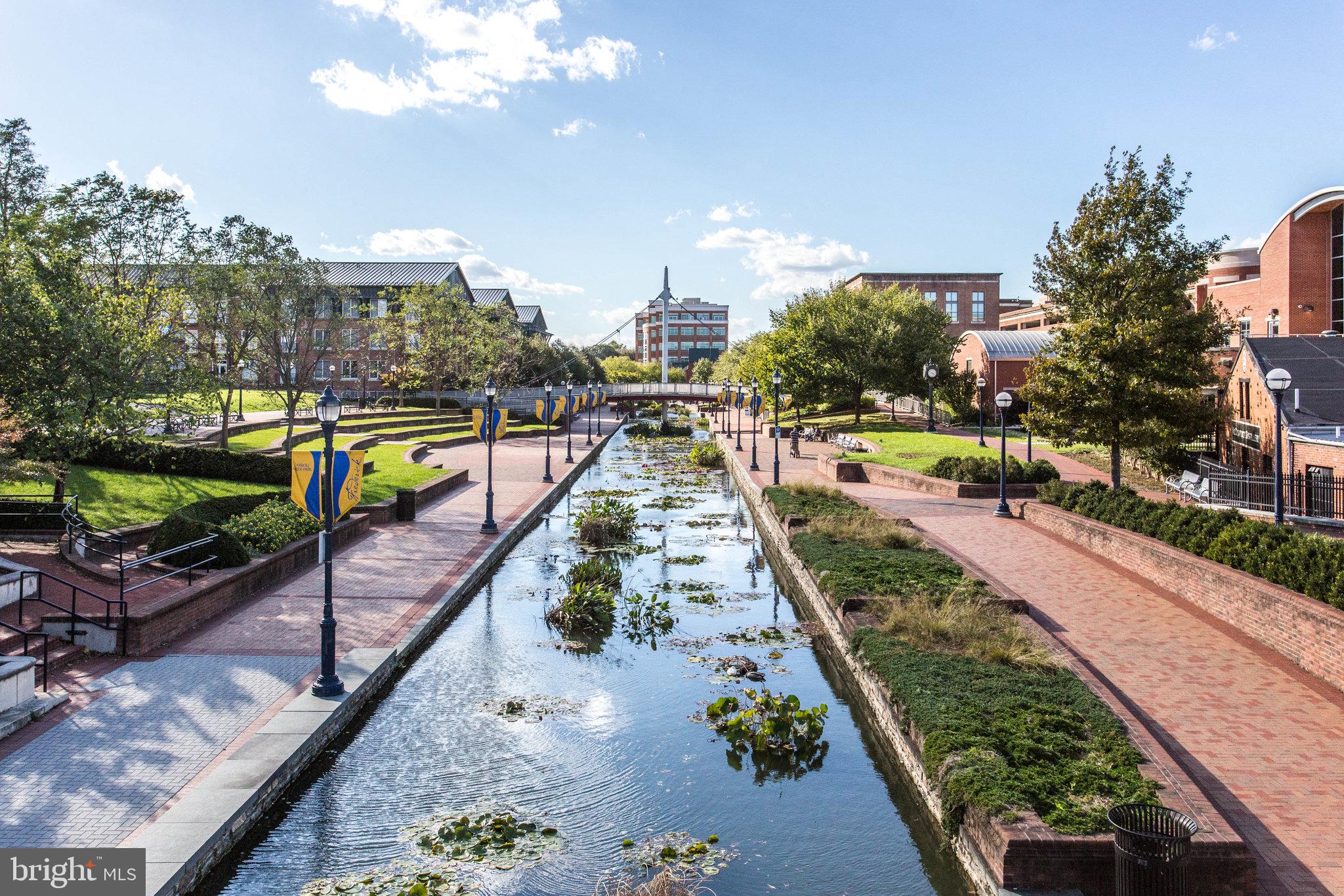 2500 Waterside Drive, Unit 303 Frederick, MD 21701 - Photo 44 of 47 a view of a swimming pool with a patio and a yard