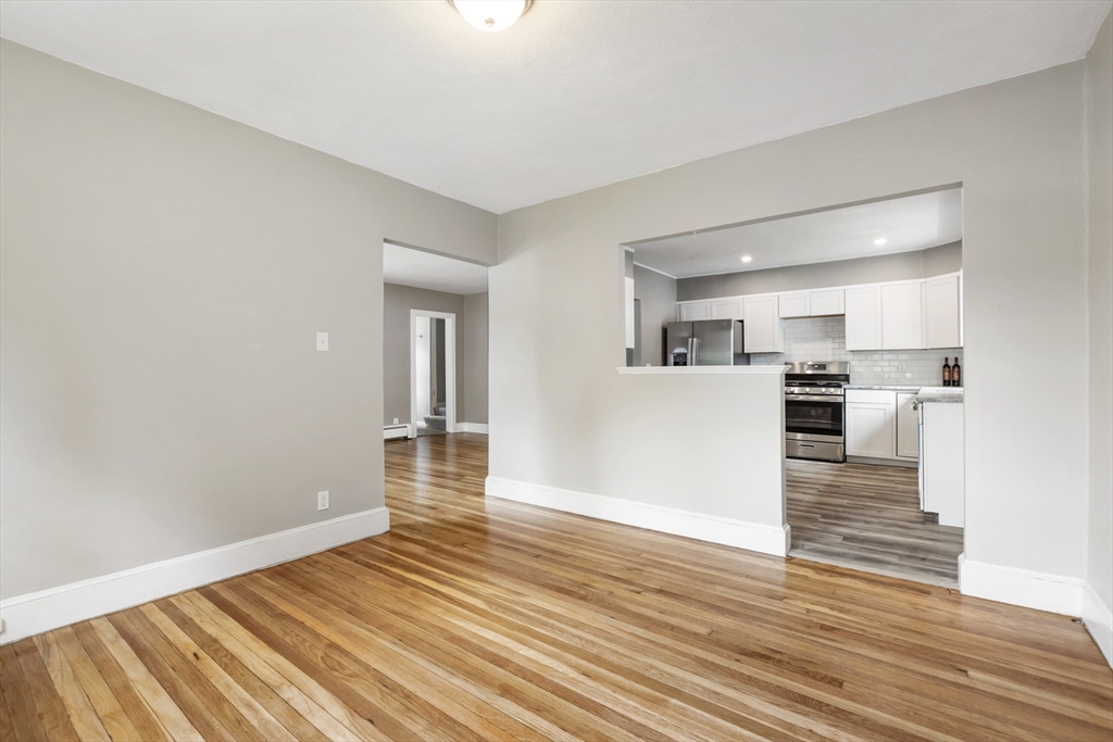 26 Riverside Drive Dedham, MA 02026 - Photo 11 of 35 a view of a kitchen with wooden floor and a kitchen