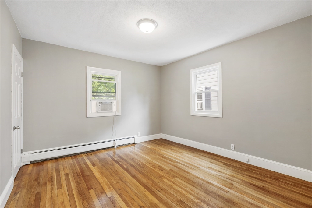 26 Riverside Drive Dedham, MA 02026 - Photo 18 of 35 a view of empty room with wooden floor