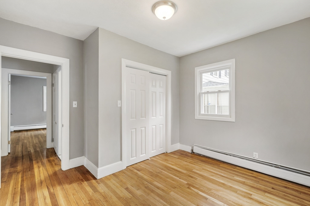26 Riverside Drive Dedham, MA 02026 - Photo 20 of 35 a view of empty room with wooden floor and fan