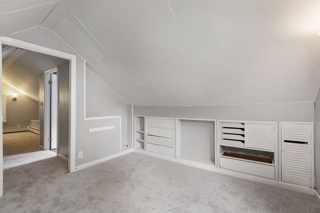 26 Riverside Drive Dedham, MA 02026 - Photo 25 of 35 an empty room with closet and windows