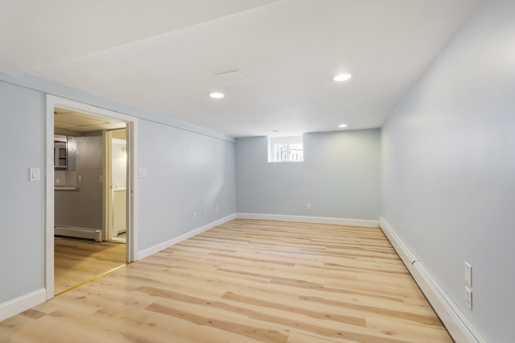 26 Riverside Drive Dedham, MA 02026 - Photo 27 of 35 a view of empty room with wooden floor