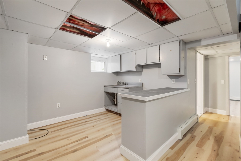 26 Riverside Drive Dedham, MA 02026 - Photo 30 of 35 a kitchen with a sink cabinets and window