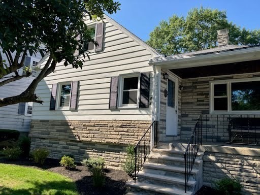 26 Riverside Drive Dedham, MA 02026 - Photo 3 of 35 a view of a house with a yard