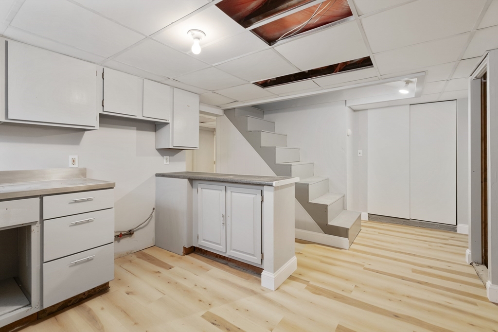 26 Riverside Drive Dedham, MA 02026 - Photo 31 of 35 a view of entryway and hall with wooden floor