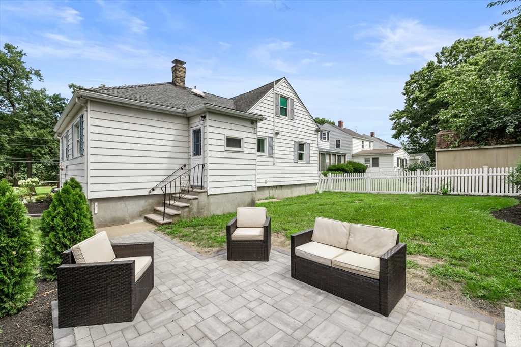26 Riverside Drive Dedham, MA 02026 - Photo 6 of 35 a view of a patio with couches chairs and a yard