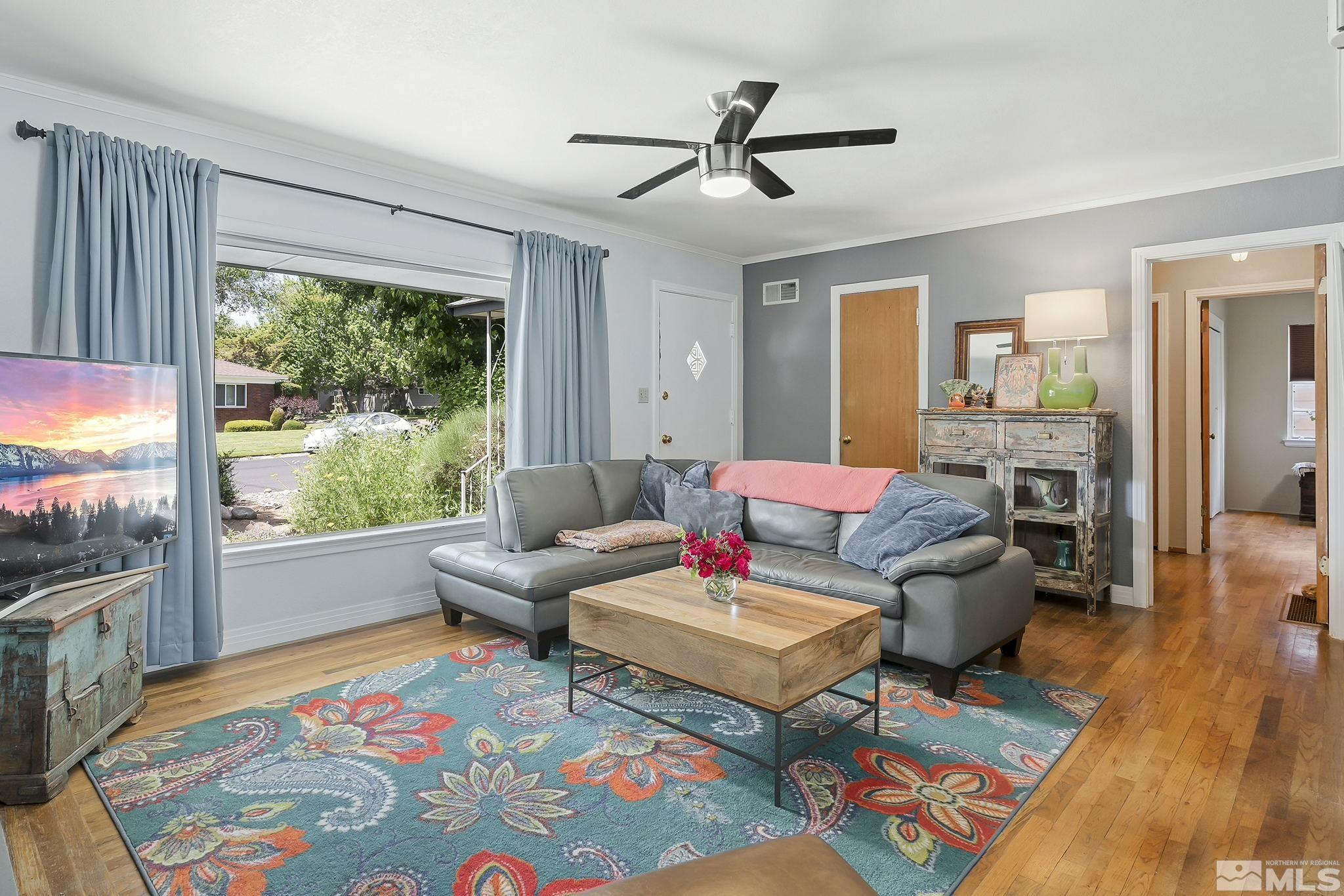 620 Cardinal Way Reno, NV 89509 - Photo 2 of 18 a living room with furniture and a wooden floor