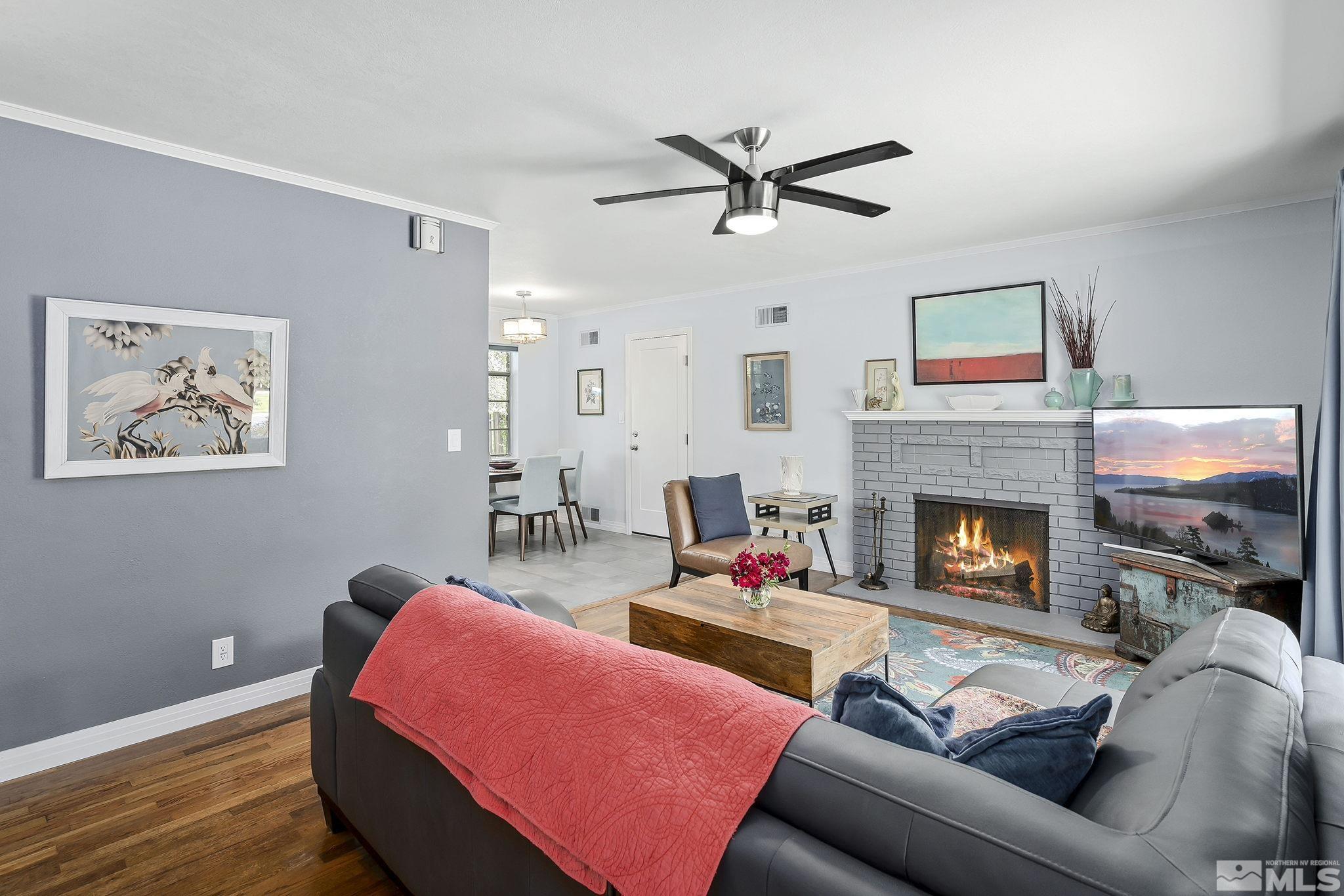 620 Cardinal Way Reno, NV 89509 - Photo 4 of 18 a living room with furniture and a fireplace