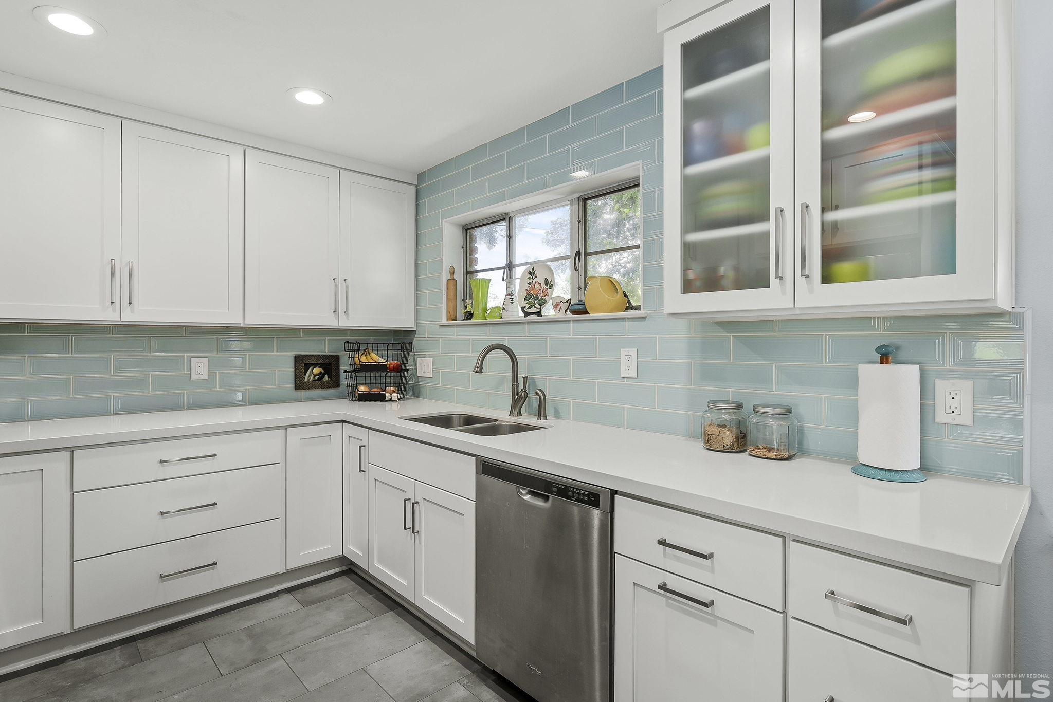 620 Cardinal Way Reno, NV 89509 - Photo 8 of 18 a kitchen with cabinets appliances and a sink