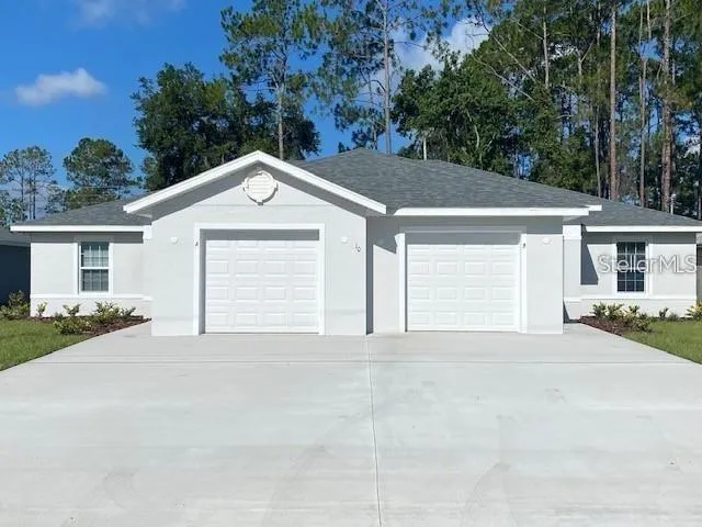 a view of a house with a outdoor space and a street