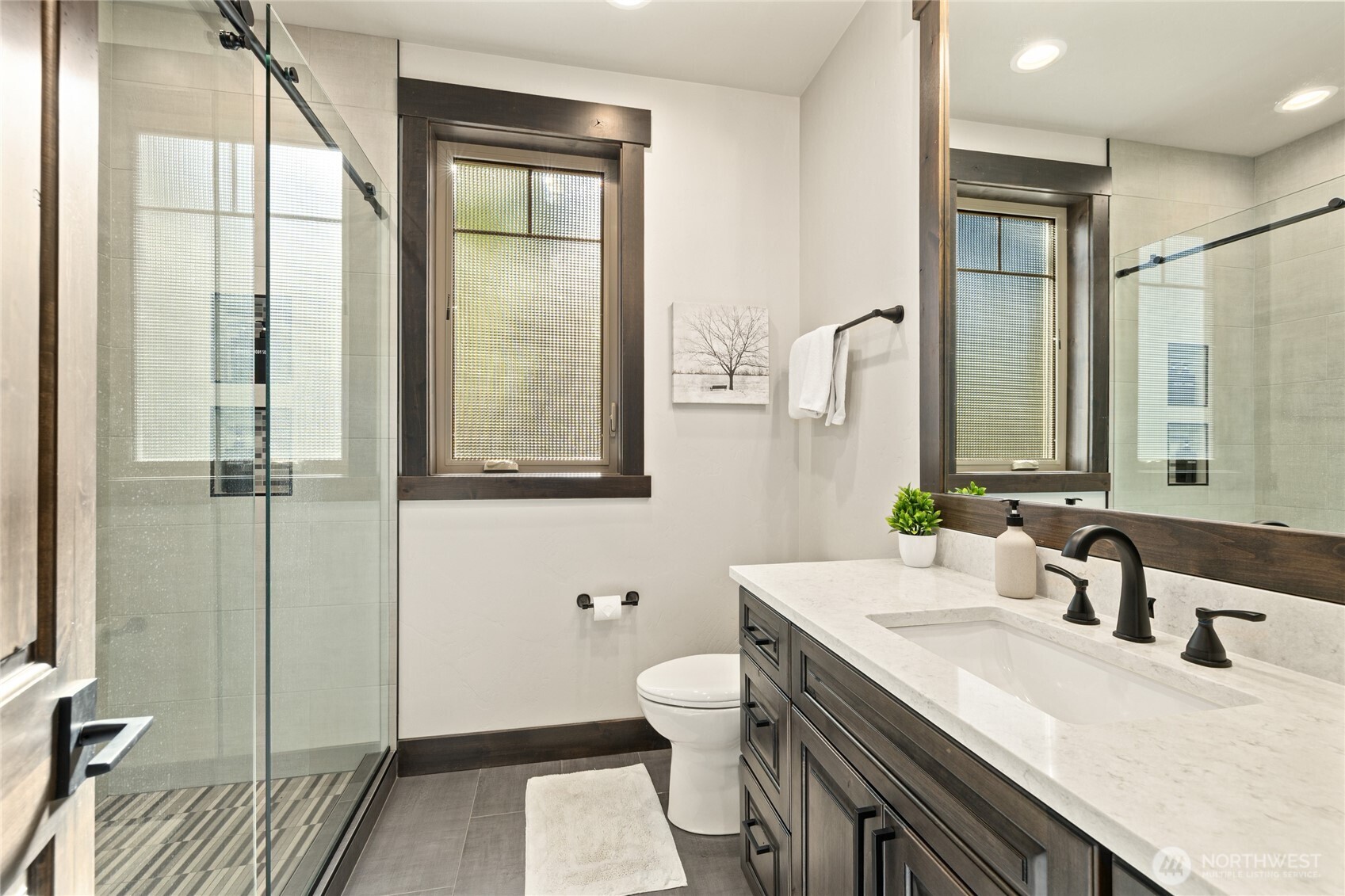 890 Larkspur Loop Cle Elum, WA 98922 - Photo 29 of 40 a bathroom with a granite countertop sink mirror vanity and toilet
