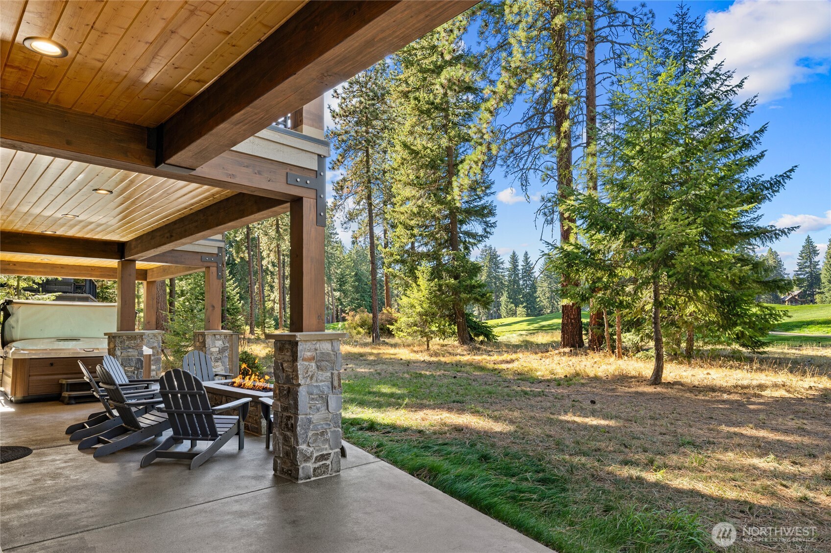 890 Larkspur Loop Cle Elum, WA 98922 - Photo 3 of 40 a view of a patio with table and chairs and floor to ceiling window with wooden fence