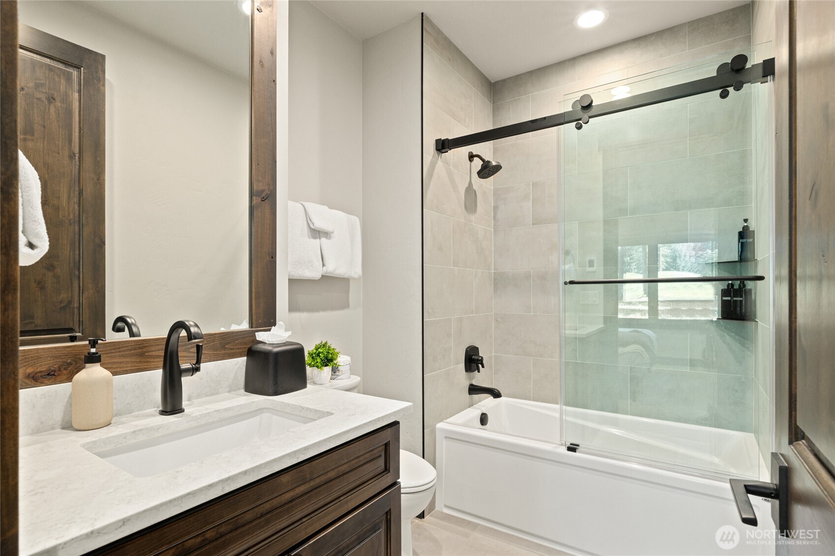 890 Larkspur Loop Cle Elum, WA 98922 - Photo 31 of 40 a bathroom with a granite countertop sink a toilet a mirror and shower
