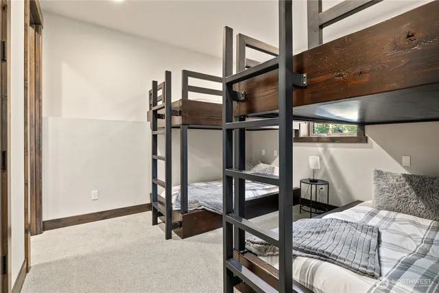 a view of a livingroom with furniture and stairs