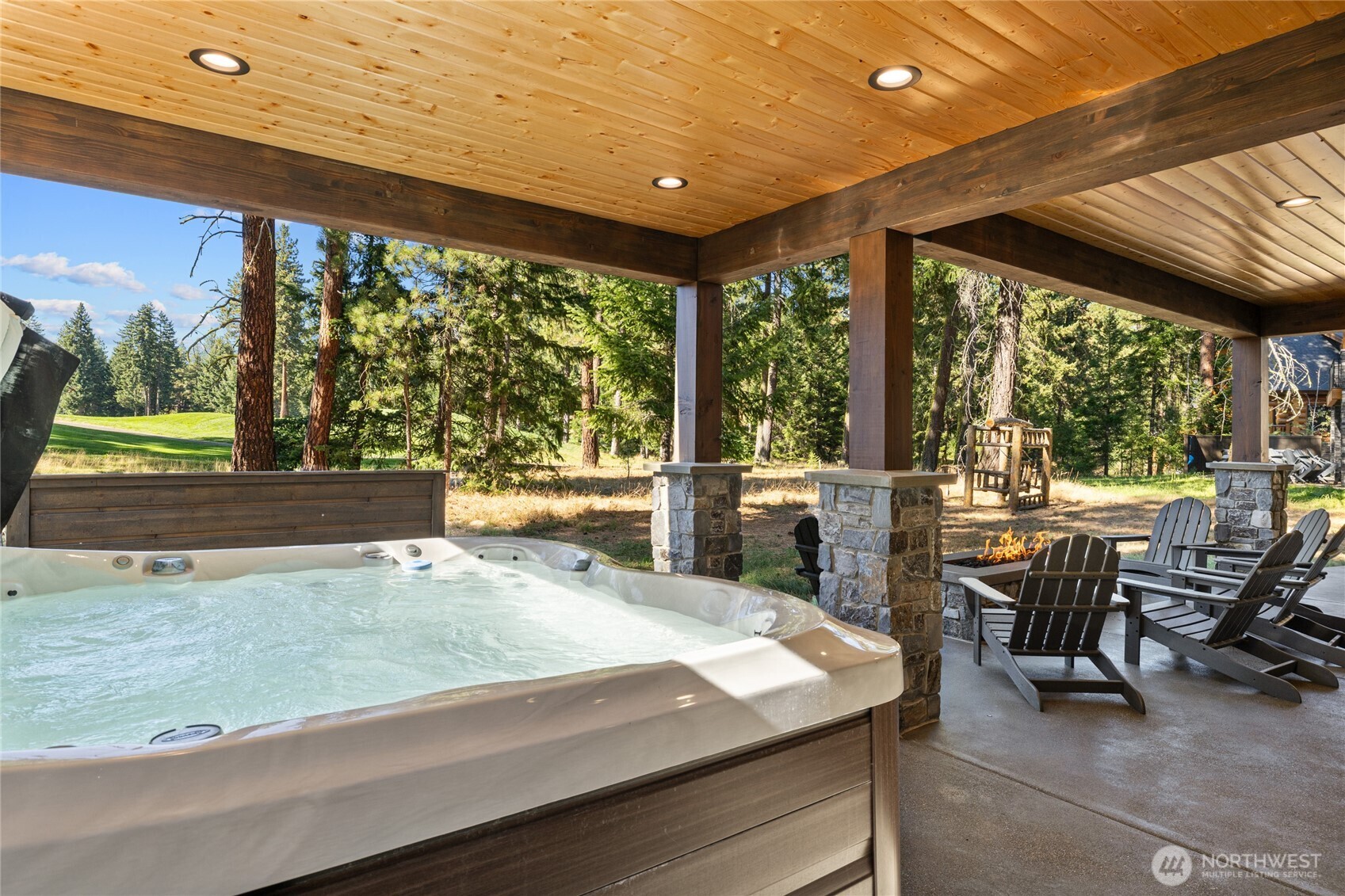 890 Larkspur Loop Cle Elum, WA 98922 - Photo 36 of 40 a view of a patio with table and chairs and couches with wooden floor