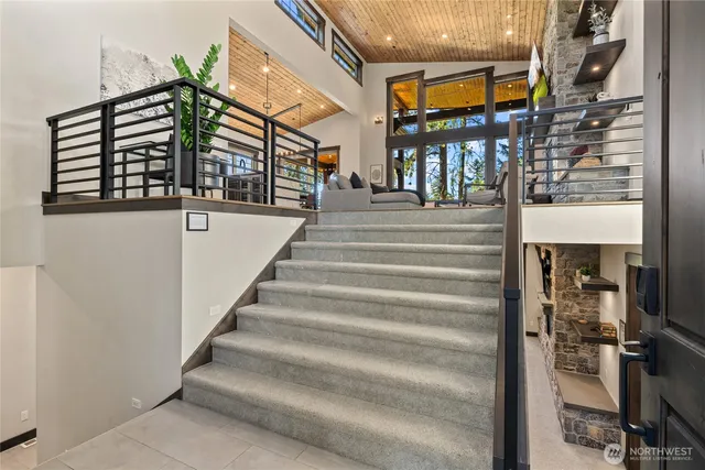 a view of staircase with a rug