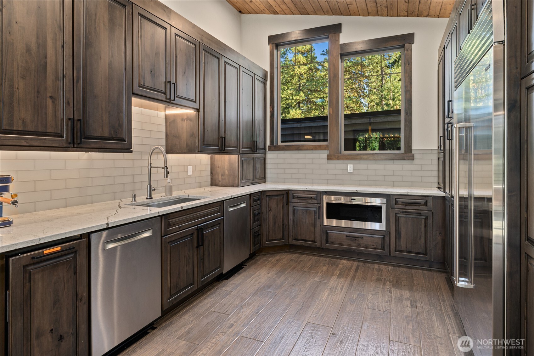 890 Larkspur Loop Cle Elum, WA 98922 - Photo 10 of 40 a kitchen with stainless steel appliances granite countertop a sink and wooden cabinets