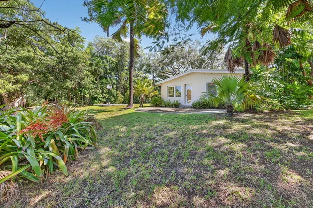 a bathroom with a sink mirror bathtub and toilet