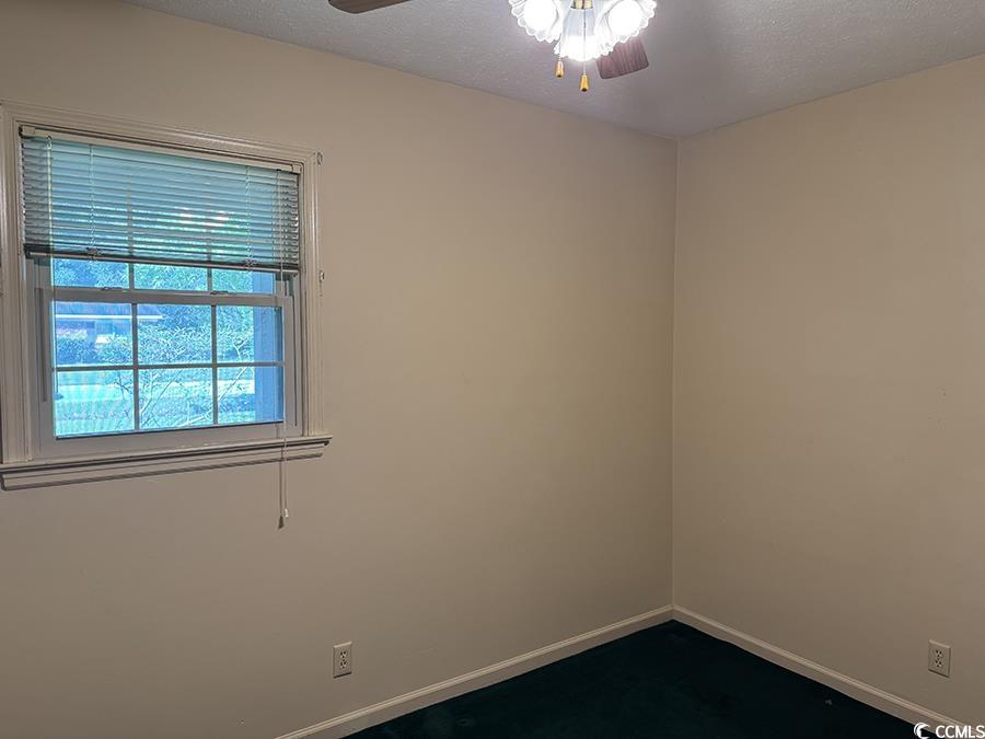 4041 Long Line Lane Myrtle Beach, SC 29579 - Photo 3 of 20 Spare room featuring ceiling fan and baseboards