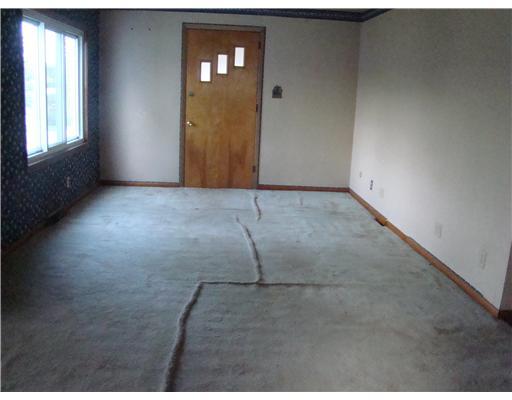 244 East Pike Road Indiana, PA 15701 - Photo 4 of 6 Living Room. Old carpeting needs lifted -hardwood floor underneath