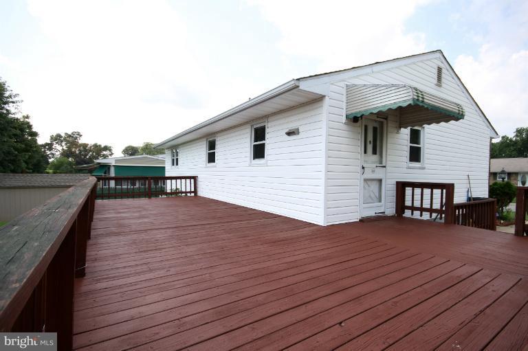 9125 Santa Rita Road Baltimore, MD 21236 - Photo 3 of 8 a view of a house with wooden deck